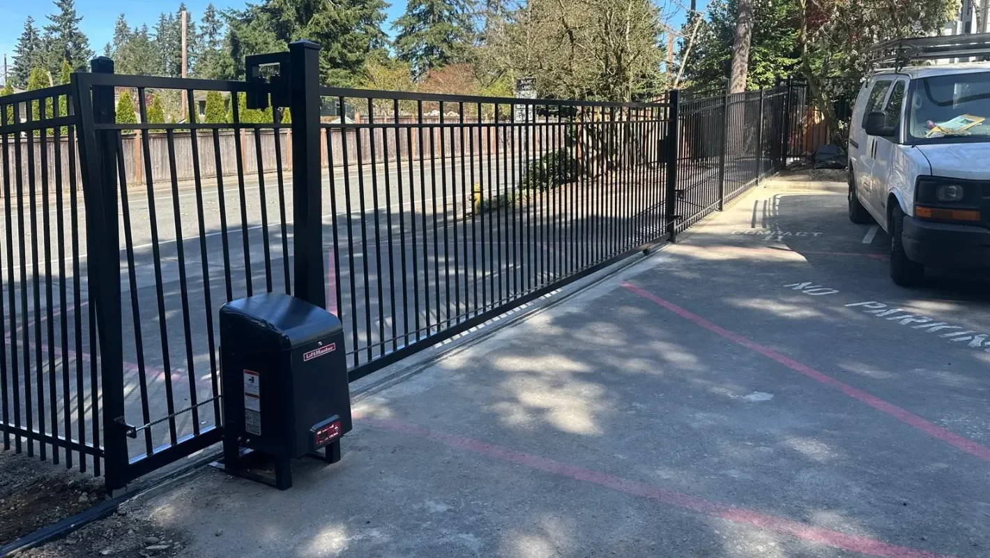 Electric gate opener system installed on metal gate in florida, miami residential home