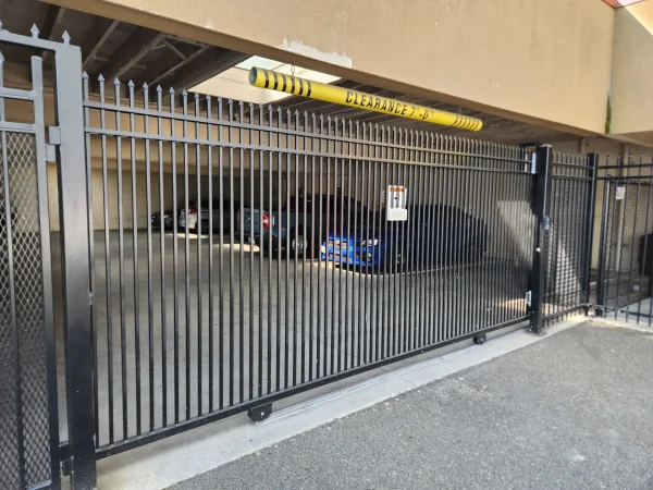 Heavy duty steel security gate protecting commercial church parking entrance