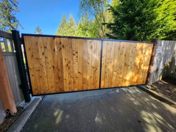 Automatic wooden driveway gate with gate opener and access control keypad