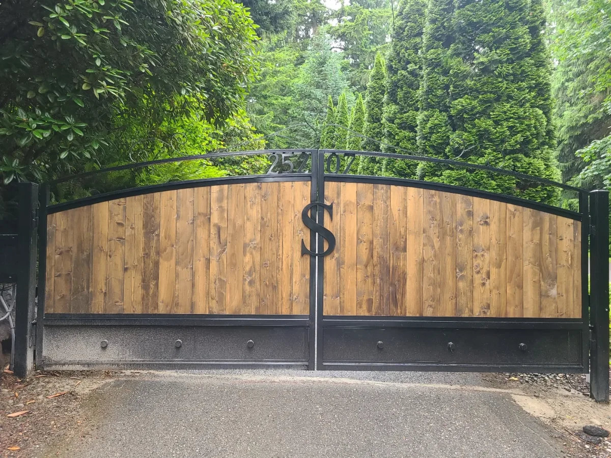 Custom wooden driveway gate installed at a residential property in Florida