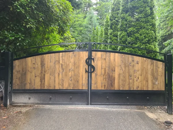 Custom wooden driveway gate installed at a residential property in Florida