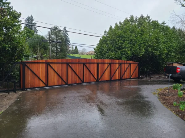 Horizontal wood gate design installed at modern residential driveway entrance