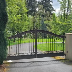 Custom wrought iron security gate installed at commercial property entrance