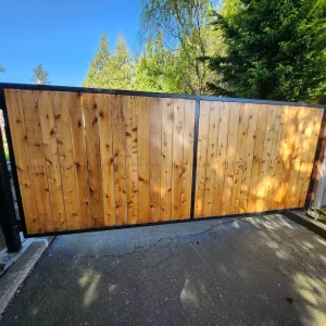 Automatic wooden driveway gate with gate opener and access control keypad