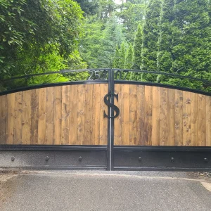 Custom wooden driveway gate installed at a residential property in Florida