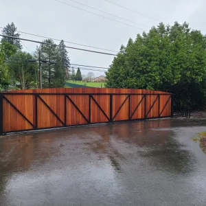 Horizontal wood gate design installed at modern residential driveway entrance